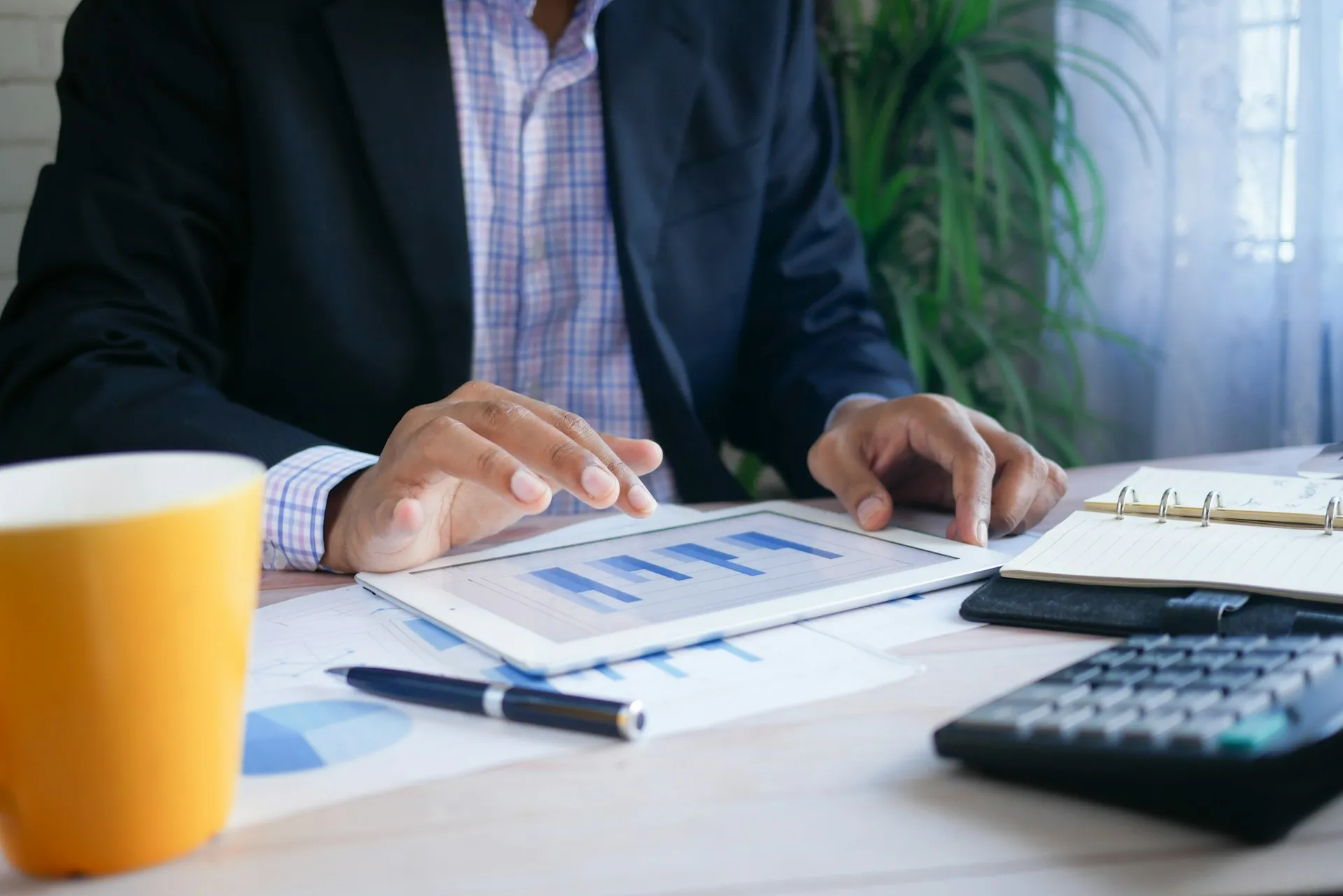 A man reviewing financial statements at a desk