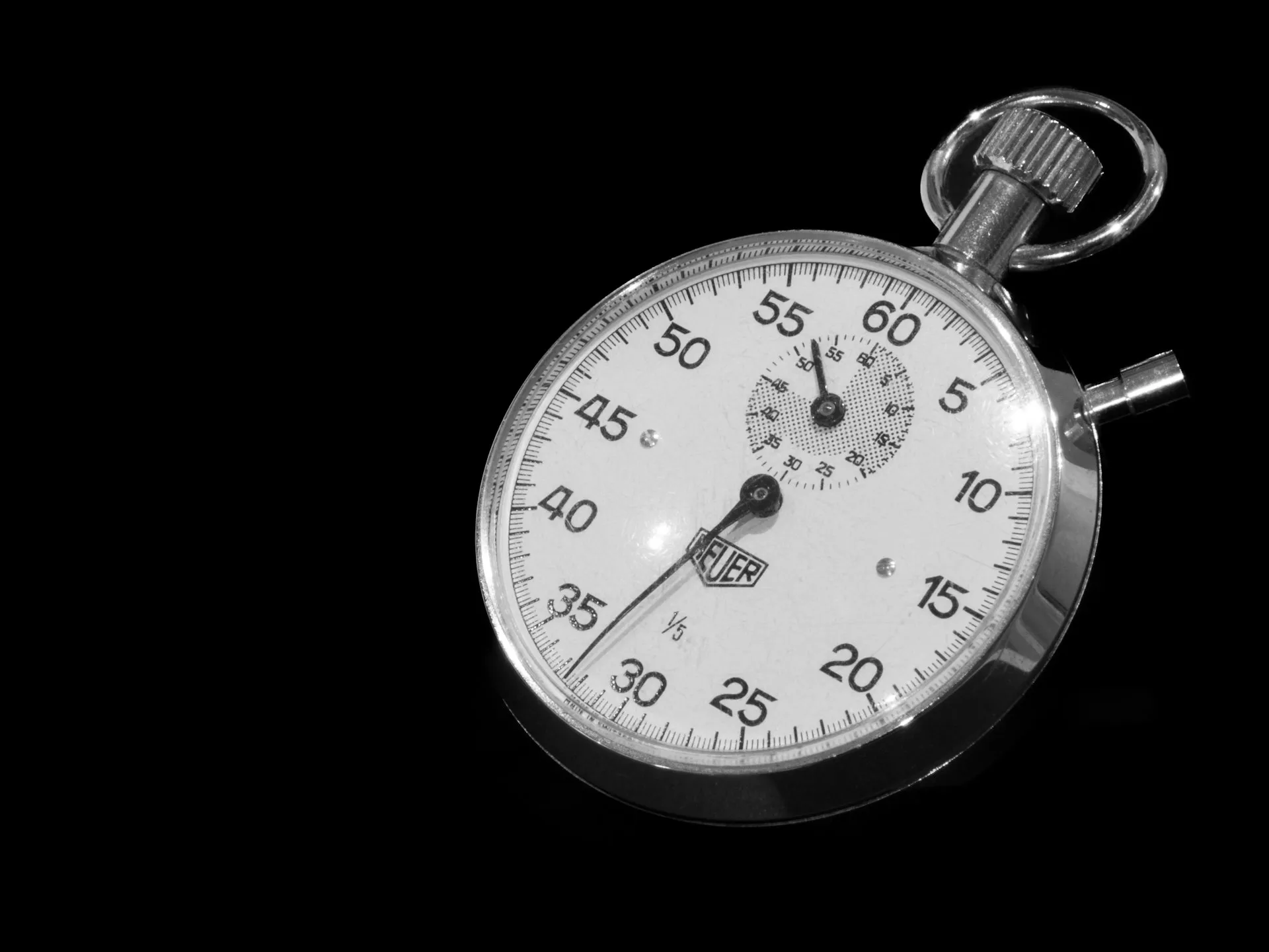 Close-up of a stopwatch mid-count, representing time tracking on support tickets